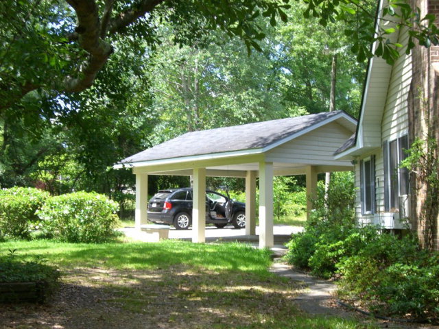 720 Turner Woods Road Gray, GA 31032 - Photo 18 of 22 a view of a house with a yard and porch