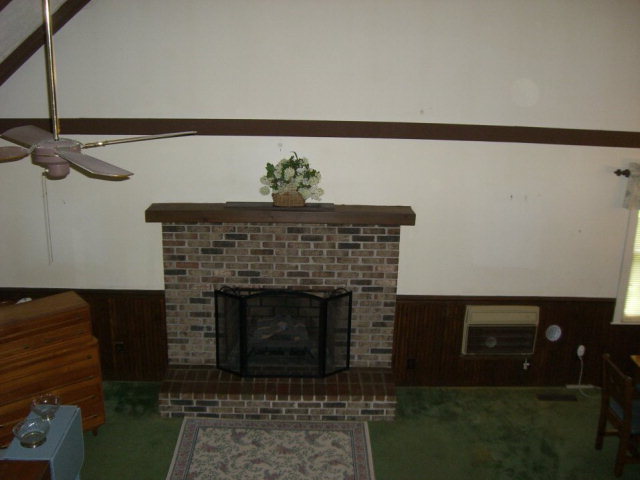 720 Turner Woods Road Gray, GA 31032 - Photo 5 of 22 a living room with a fireplace