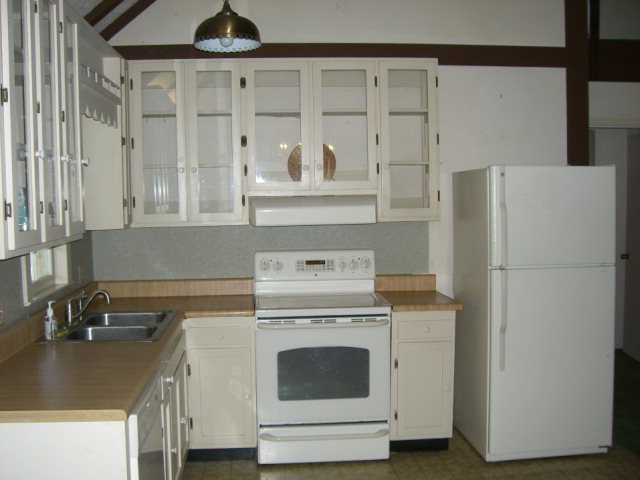720 Turner Woods Road Gray, GA 31032 - Photo 6 of 22 a kitchen with a stove and a refrigerator