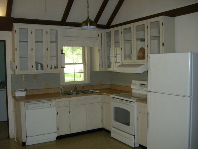 720 Turner Woods Road Gray, GA 31032 - Photo 7 of 22 a kitchen with a sink stove and cabinets