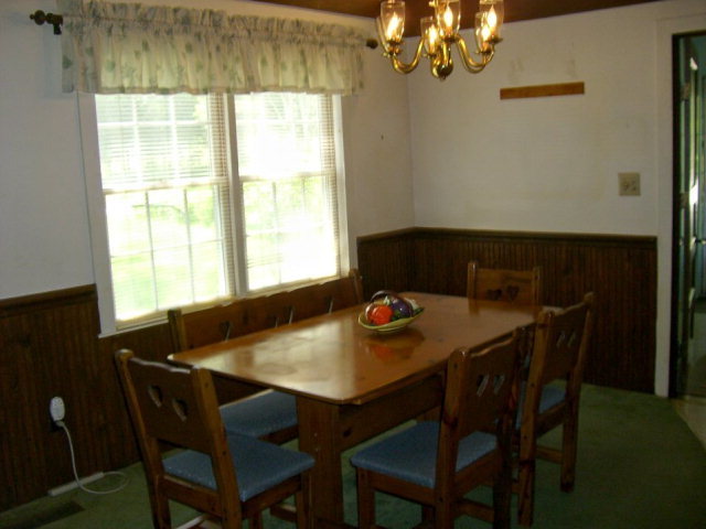720 Turner Woods Road Gray, GA 31032 - Photo 8 of 22 a view of a dining room with a table and chairs