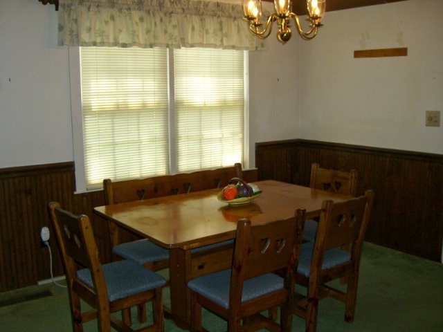 720 Turner Woods Road Gray, GA 31032 - Photo 9 of 22 a view of a dining room with a table and chairs