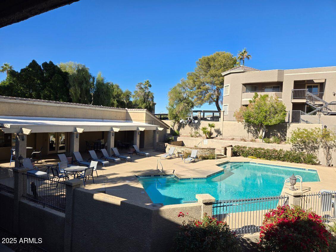 1720 East Thunderbird Road, Unit 2015 Phoenix, AZ 85022 - Photo 12 of 25 a view of a swimming pool with outdoor seating and plants