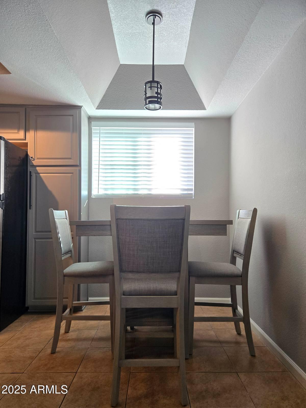 1720 East Thunderbird Road, Unit 2015 Phoenix, AZ 85022 - Photo 14 of 25 a view of a dining room with furniture and window