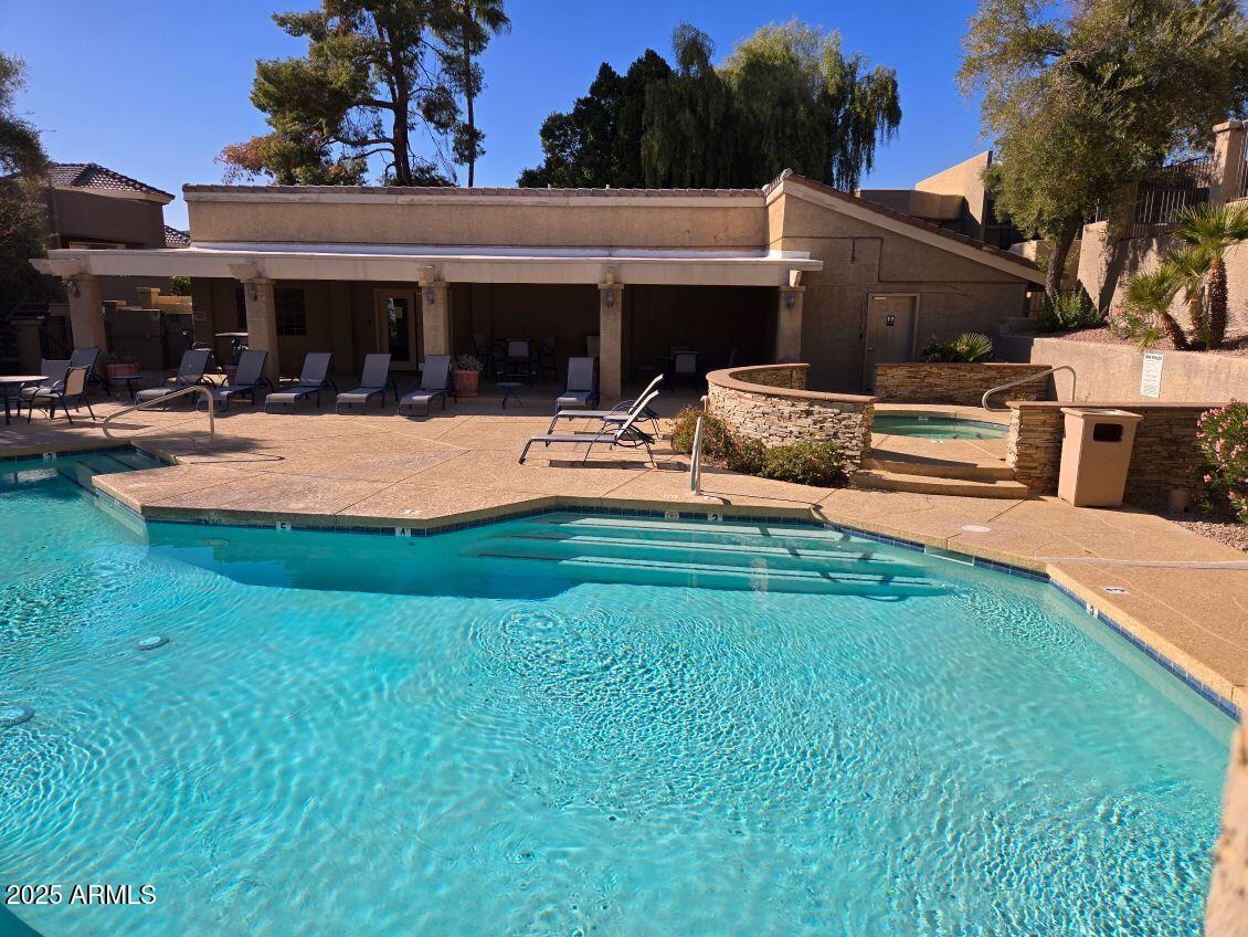 1720 East Thunderbird Road, Unit 2015 Phoenix, AZ 85022 - Photo 25 of 25 a view of a patio with table and chairs with plants and wooden fence