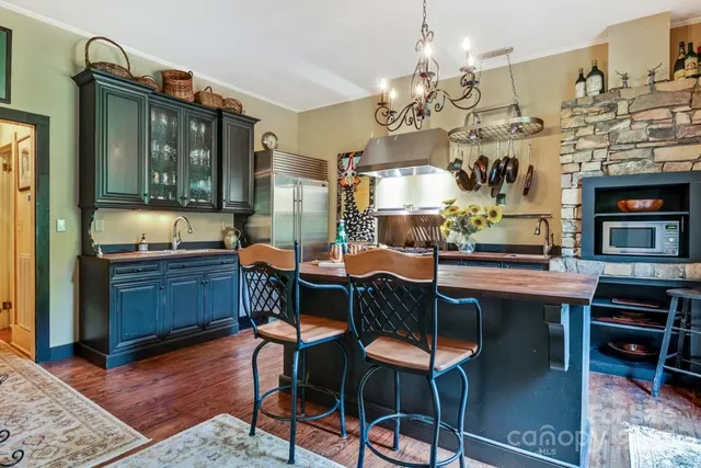 a dining room with a table and chairs
