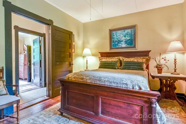 a bedroom with bed and window