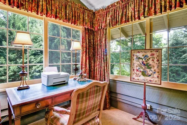 a reading room with furniture and a window