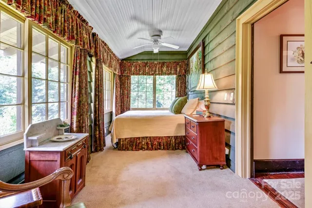 a bed room with a bed and a window