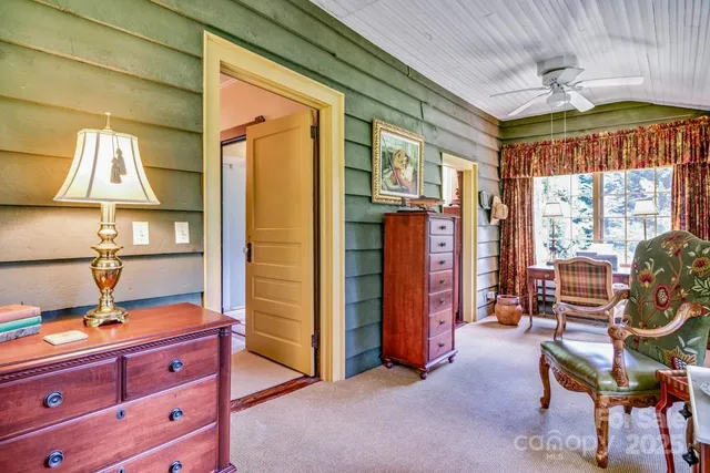 a bedroom with furniture and a window