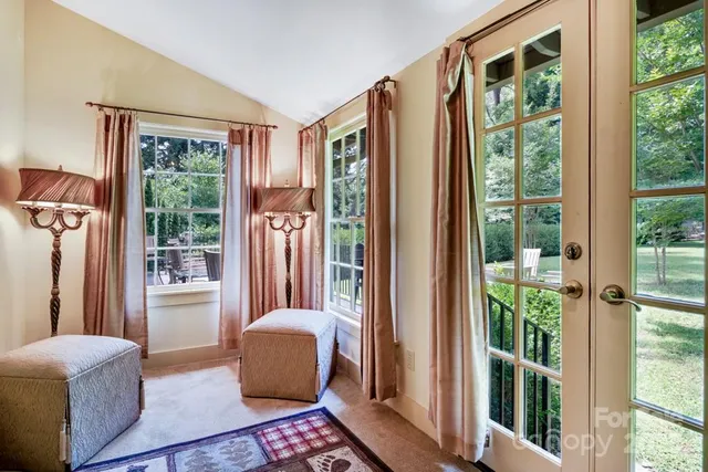 a bedroom with furniture and a window