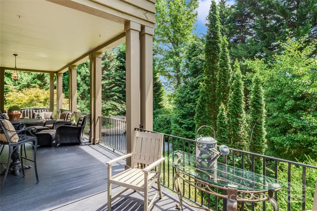 a table and chairs in front of a house