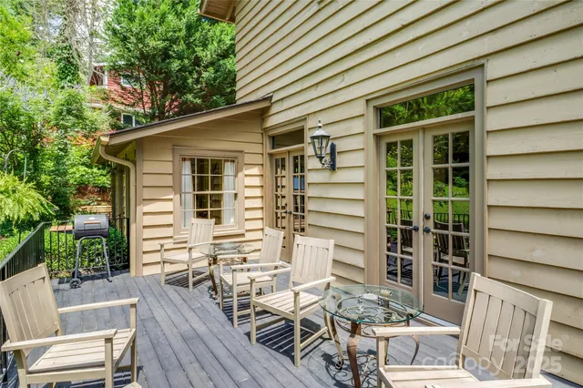 a view of yard with swimming pool and green space
