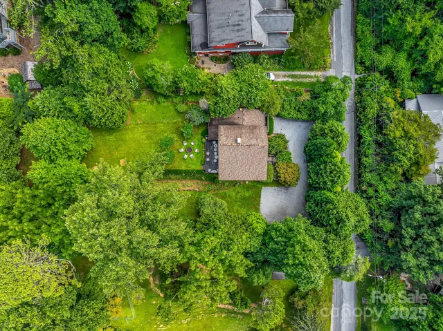 an aerial view of a house with a garden