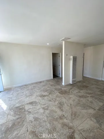 a view of wooden floor and white walls