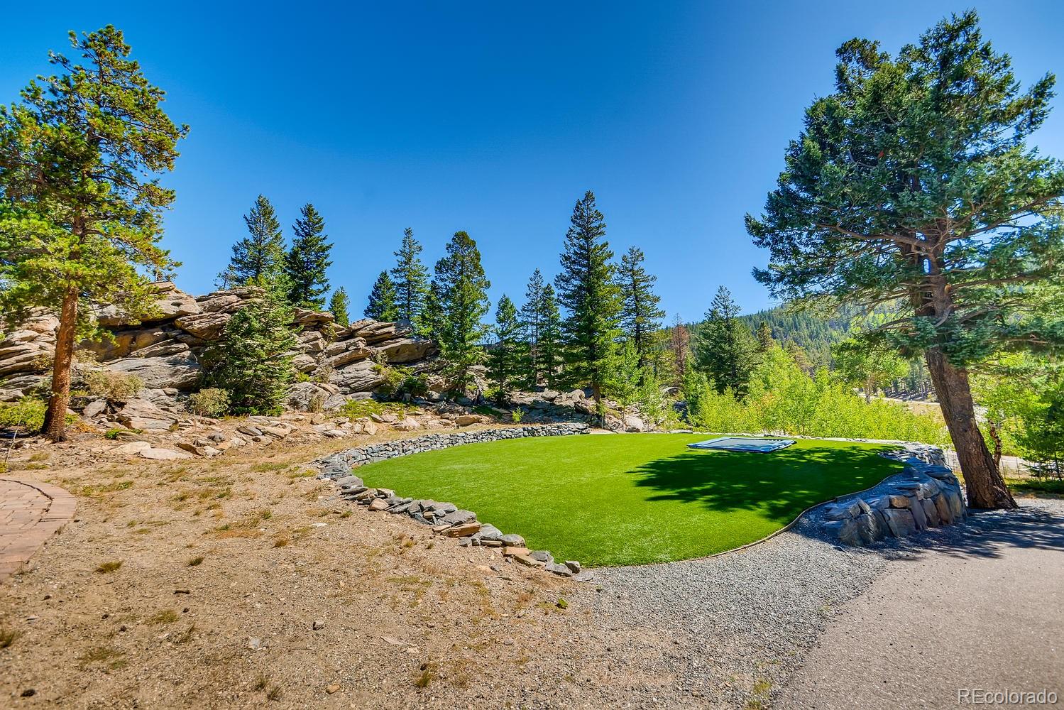 150 Outpost Lane Evergreen, CO 80439 - Photo 12 of 40 a view of a park with large trees