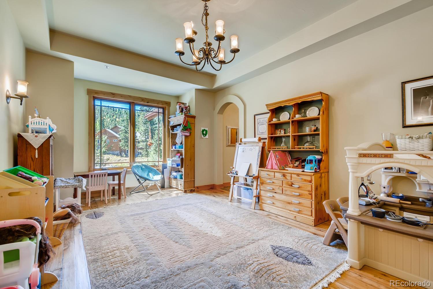 150 Outpost Lane Evergreen, CO 80439 - Photo 13 of 40 a view of a workspace with furniture and a window