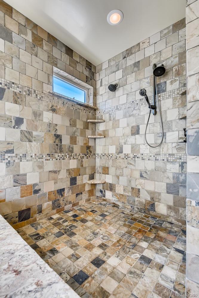 150 Outpost Lane Evergreen, CO 80439 - Photo 24 of 40 a bathroom with a shower