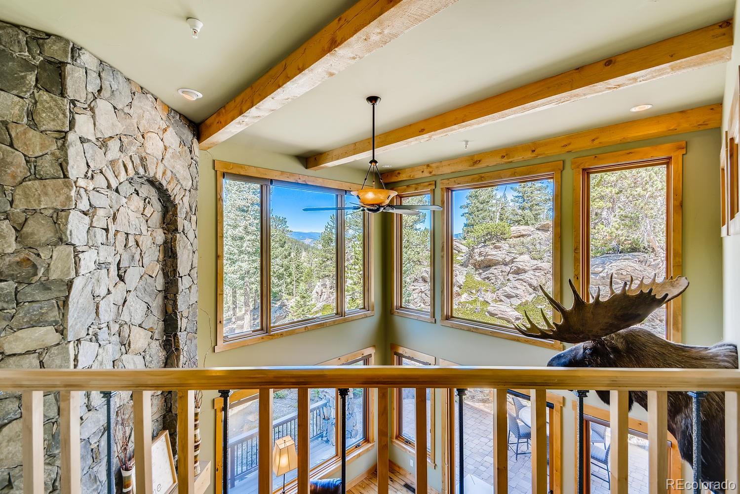 150 Outpost Lane Evergreen, CO 80439 - Photo 26 of 40 a view of a porch