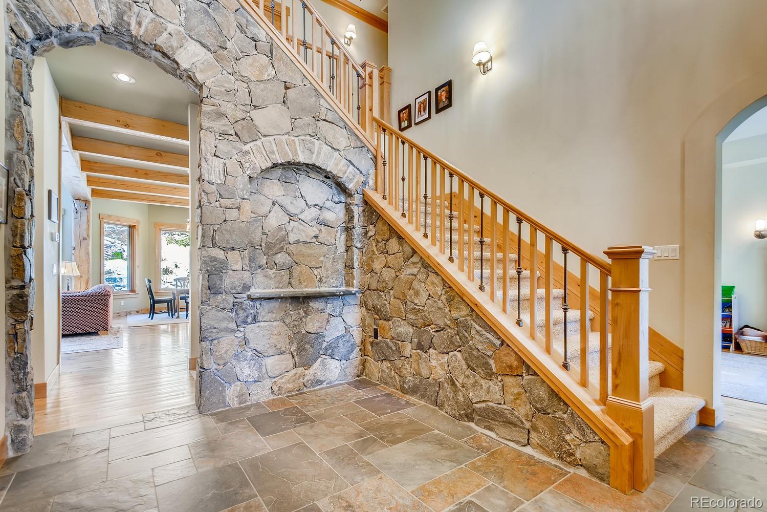150 Outpost Lane Evergreen, CO 80439 - Photo 6 of 40 a view of an entryway with staircase