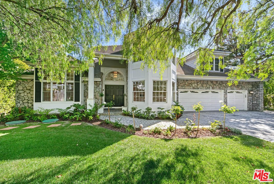 front view of a house with a garden