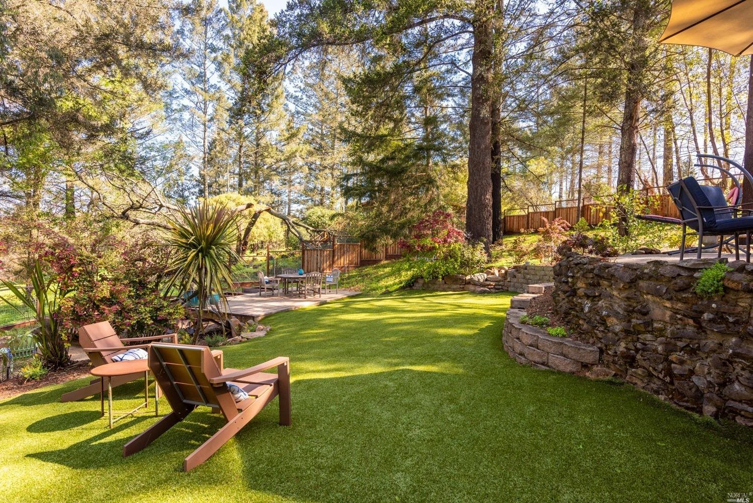 4072 Parker Hill Road Santa Rosa, CA 95404 - Photo 1 of 1 a view of a swimming pool with lawn chairs under an umbrella