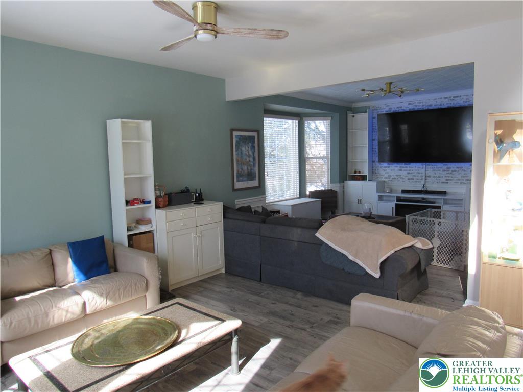 17 Wilt Road Bechtelsville, PA 19505 - Photo 11 of 38 a living room with furniture a flat screen tv and a fireplace