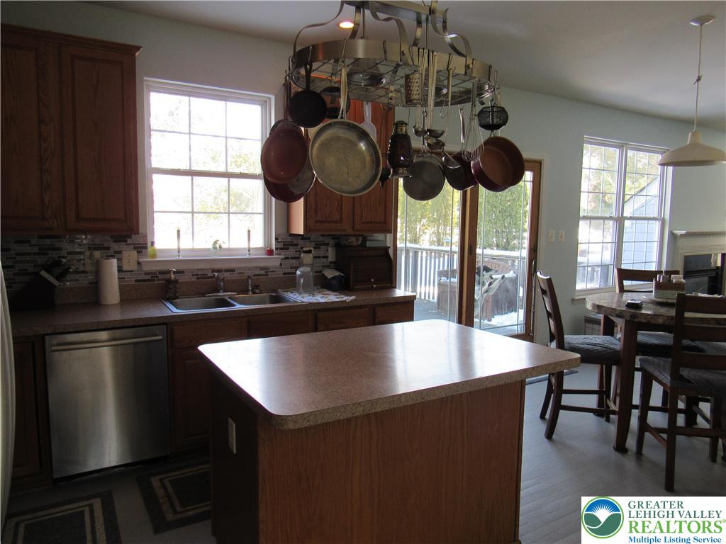 17 Wilt Road Bechtelsville, PA 19505 - Photo 18 of 38 a kitchen with stainless steel appliances granite countertop a sink a stove and a refrigerator