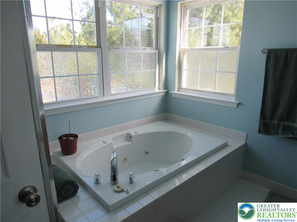 17 Wilt Road Bechtelsville, PA 19505 - Photo 27 of 38 a bath tub sitting next to a window