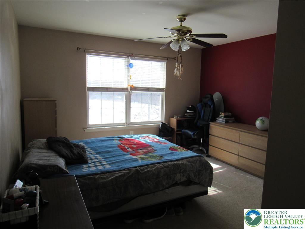 17 Wilt Road Bechtelsville, PA 19505 - Photo 28 of 38 a bedroom with a bed and window