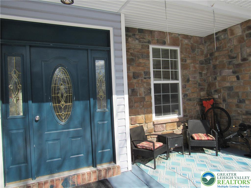 17 Wilt Road Bechtelsville, PA 19505 - Photo 6 of 38 a front view of a house with outdoor seating