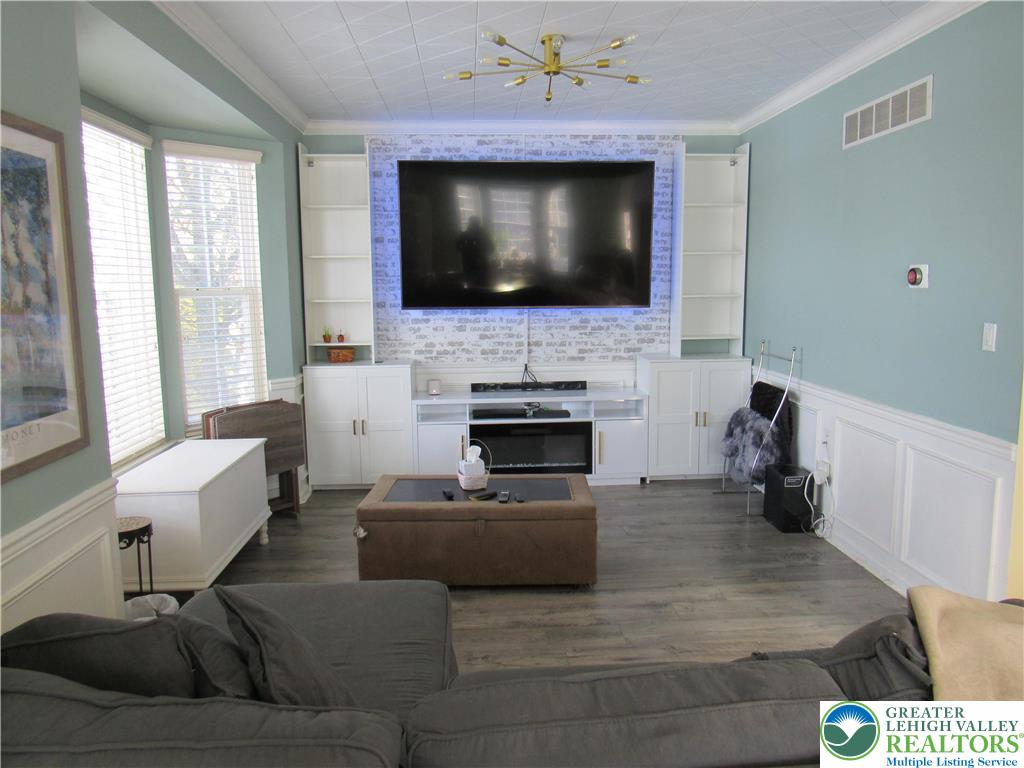 17 Wilt Road Bechtelsville, PA 19505 - Photo 9 of 38 a living room with furniture and a flat screen tv