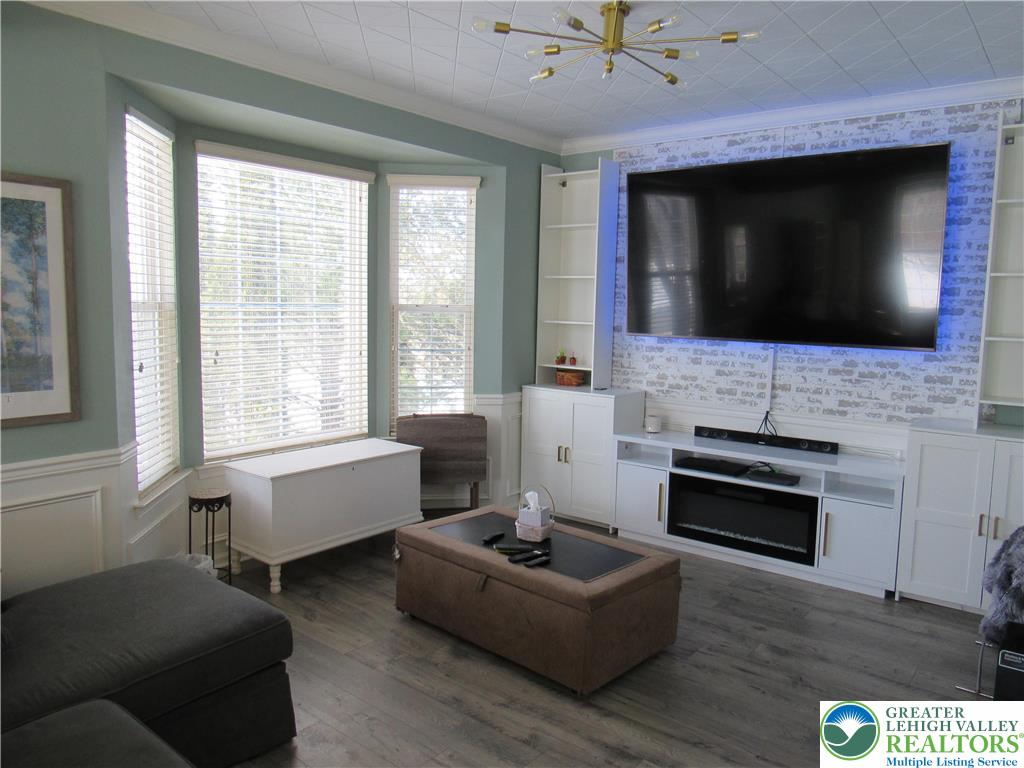 17 Wilt Road Bechtelsville, PA 19505 - Photo 10 of 38 a living room with furniture a flat screen tv and a fireplace