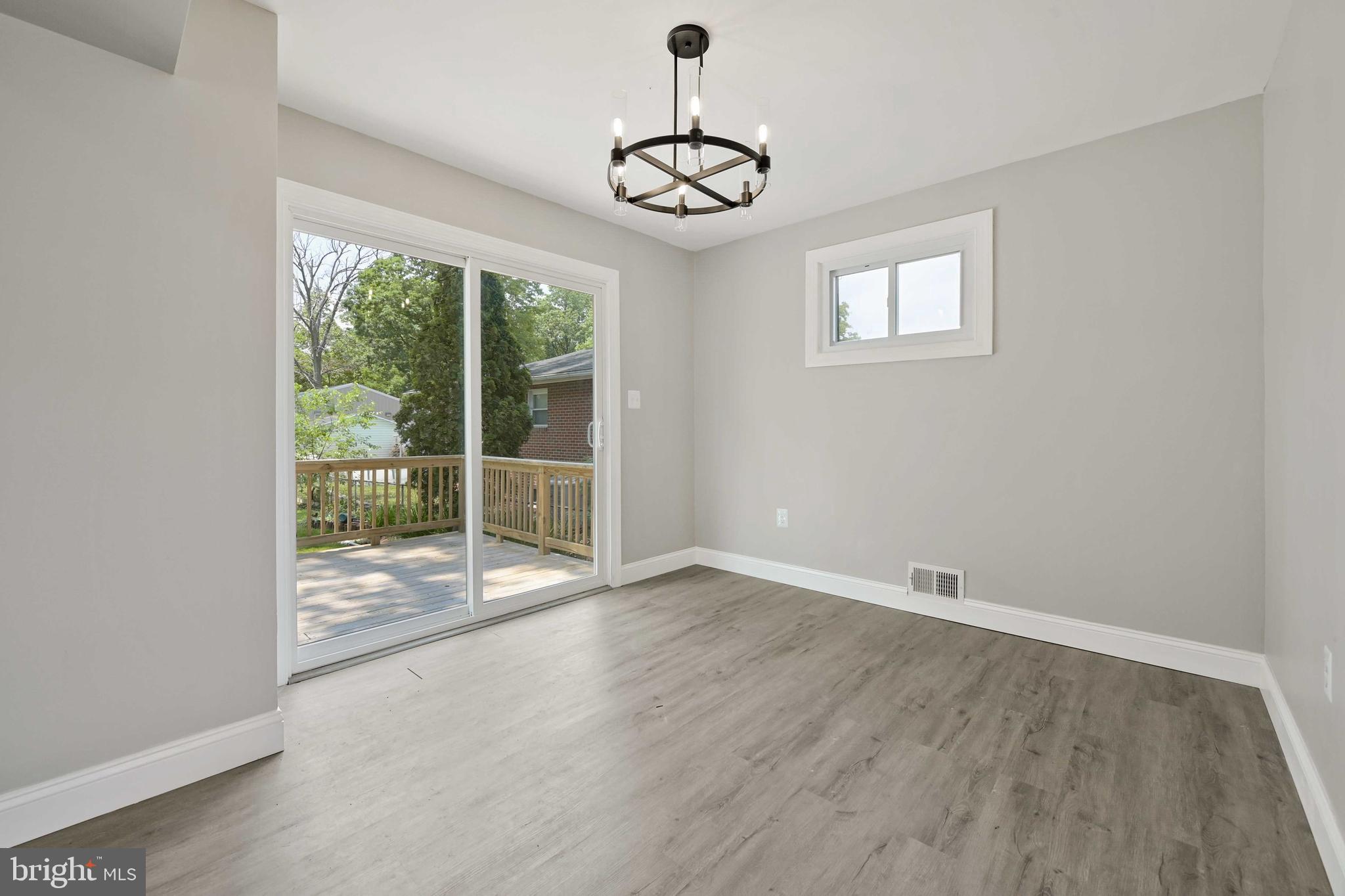 30 Stemmers Run Road Essex, MD 21221 - Photo 7 of 35 Dining Room access to Deck