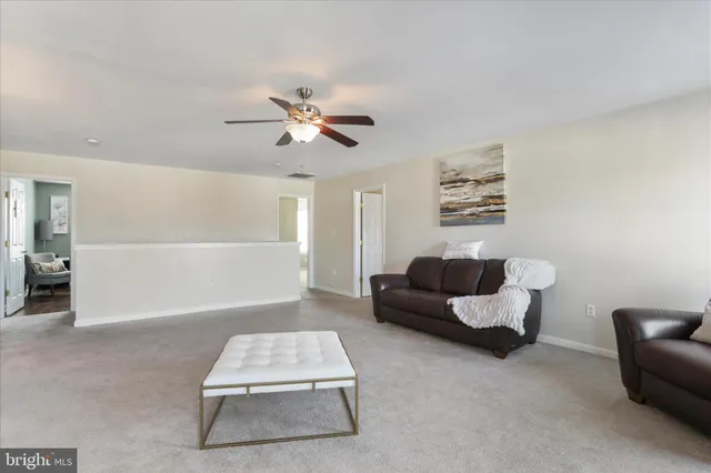 a spacious bedroom with a bed and furniture