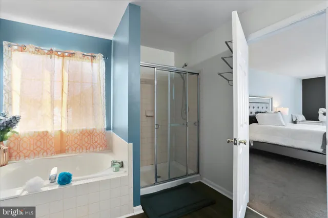 a view of a storage & utility room with two washing machine