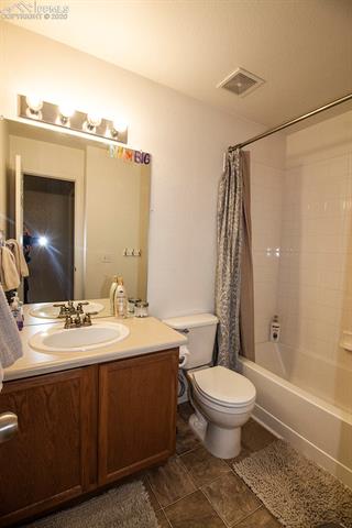 6789 Akron Road Colorado Springs, CO 80923 - Photo 21 of 28 Upper level bathroom