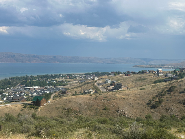 1141 Trapper Loop, Unit RV88 Garden City, UT 84028 - Photo 3 of 8 Expansive hillside property featuring panoramic lake and mountain scenery, with a town visible along the shoreline