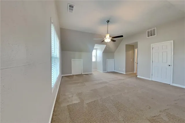 an empty room with a bathroom