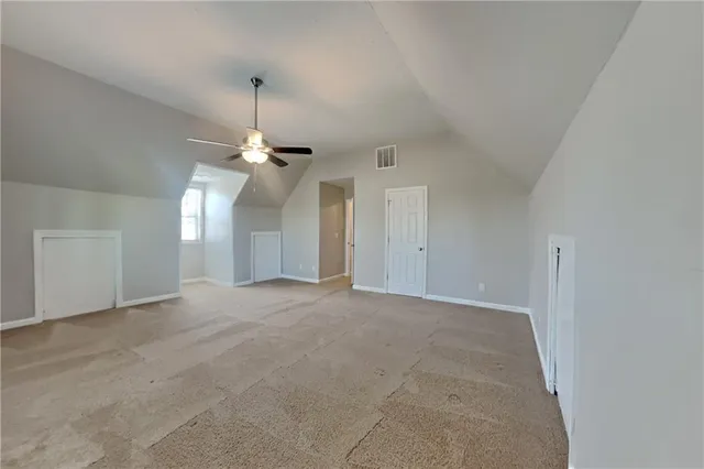 a view of a chandelier fan and entryway