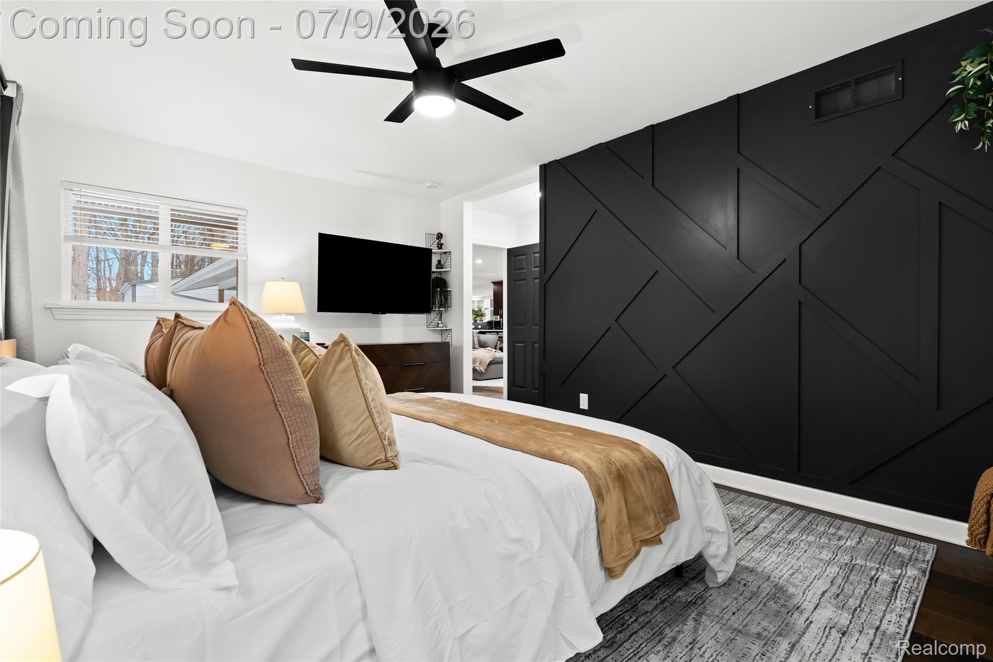2566 Harrington Road Rochester, MI 48307 - Photo 31 of 64 Master bedroom featuring a California king bed, Smart TV with a modern accent wall