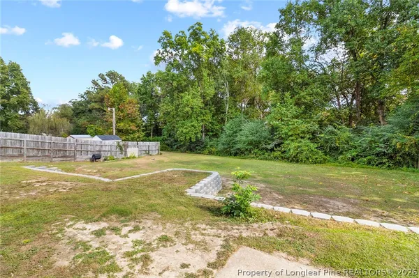 a view of a swimming pool with a yard
