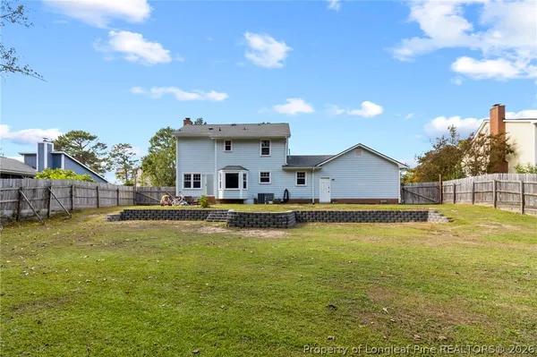 a view of a swimming pool and a yard