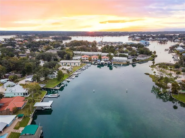 an aerial view of a residential houses with outdoor space