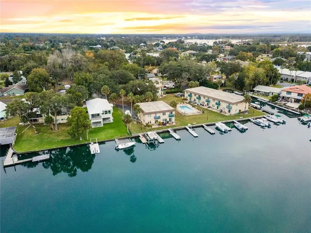 a large body of water with a building in the background