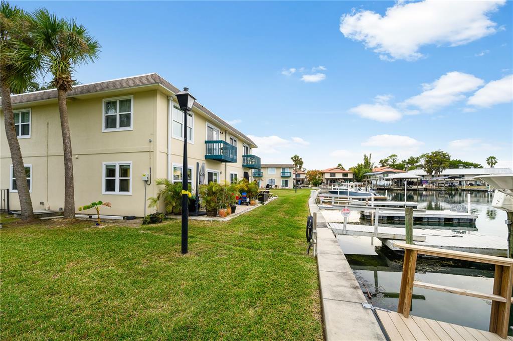 30 Southeast Valare Lane, Unit 102B Crystal River, FL 34429 - Photo 30 of 47 a view of a house with a yard