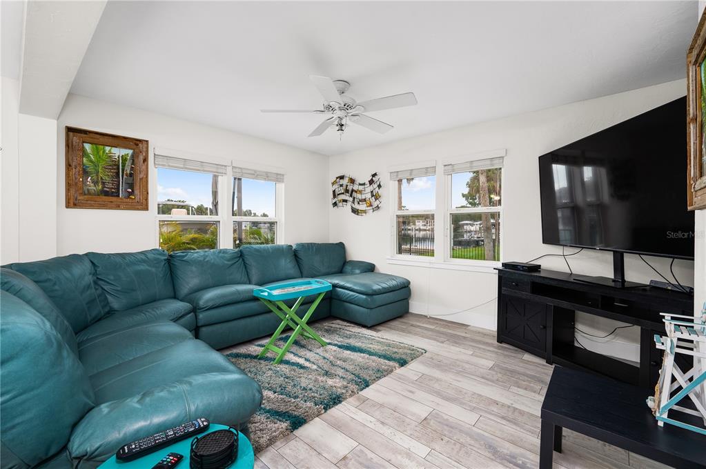 30 Southeast Valare Lane, Unit 102B Crystal River, FL 34429 - Photo 3 of 47 a living room with furniture and a flat screen tv