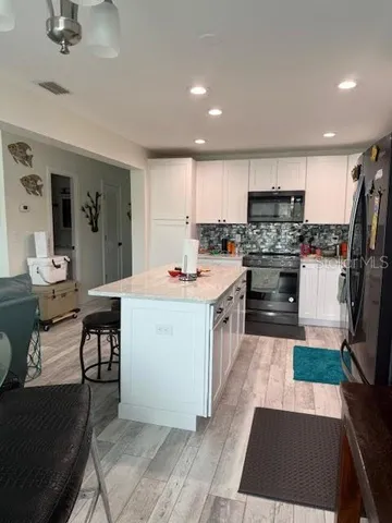 a view of a hallway with a black and white door