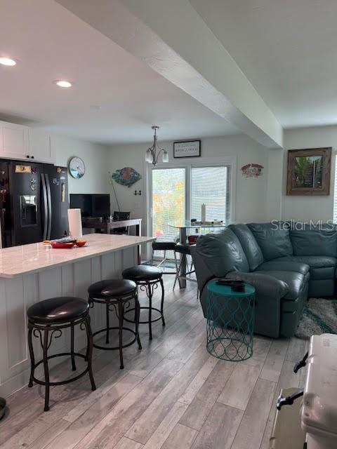 30 Southeast Valare Lane, Unit 102B Crystal River, FL 34429 - Photo 34 of 47 a living room with furniture and view of kitchen