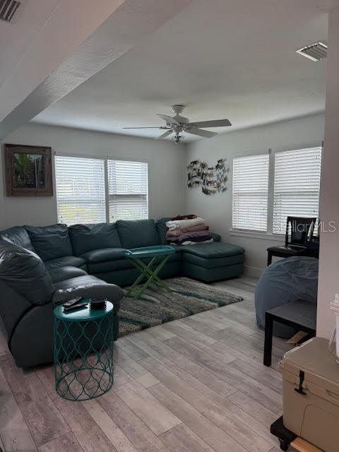 30 Southeast Valare Lane, Unit 102B Crystal River, FL 34429 - Photo 35 of 47 a living room with furniture and a flat screen tv